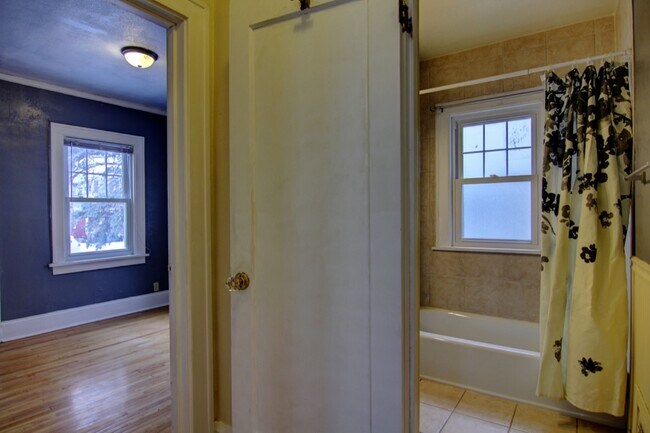 Hallway leading to main floor street side bedroom and main floor bathroom - 5427 Xerxes Ave S