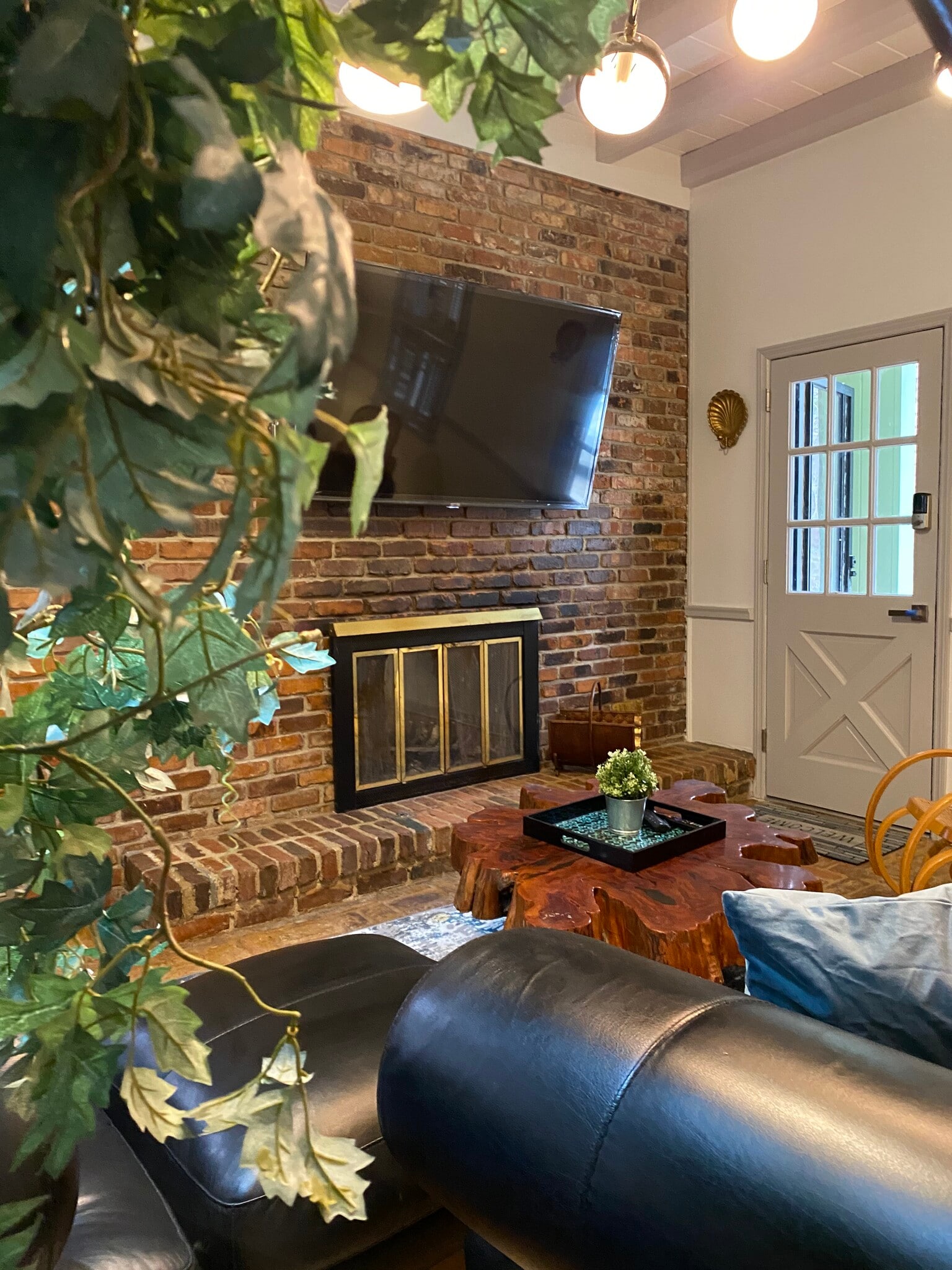 A cozy leather couch and the perfect glow — unwind, recharge, repeat. - 5460 Scofield Rd