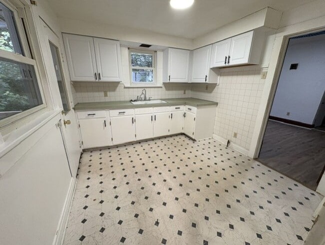 Building Photo - Updated West Akron Home with Flexible Living Space, Large Yard & Garage