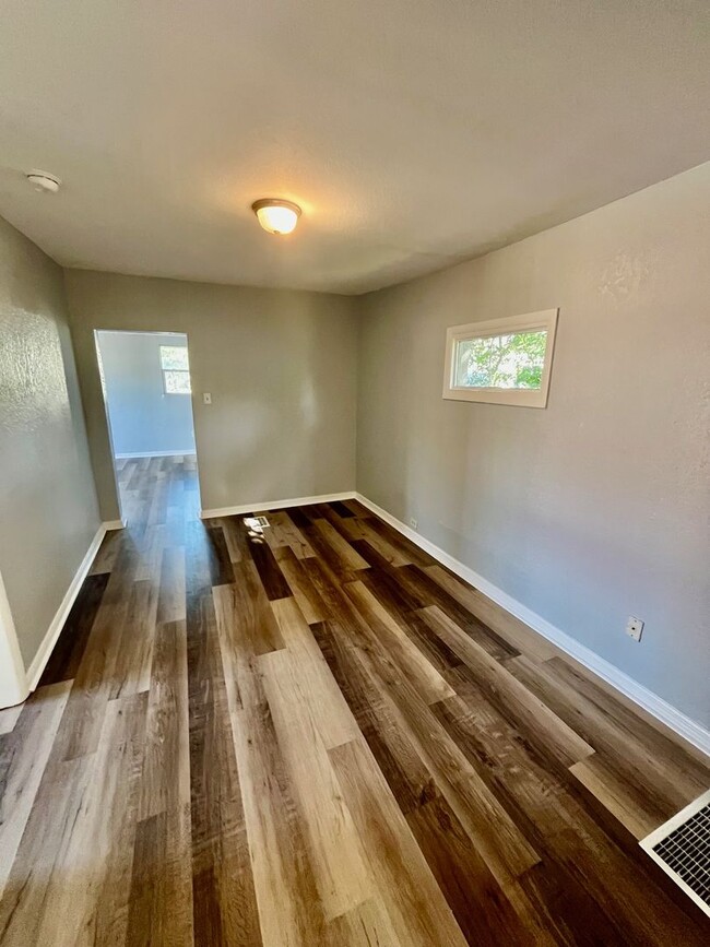 Building Photo - 3BR/1BA with HUGE Backyard, LVT Wood Floor...