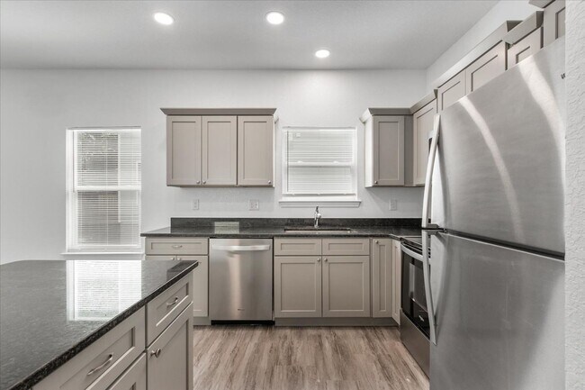 Building Photo - Spacious 4-Bedroom Townhome