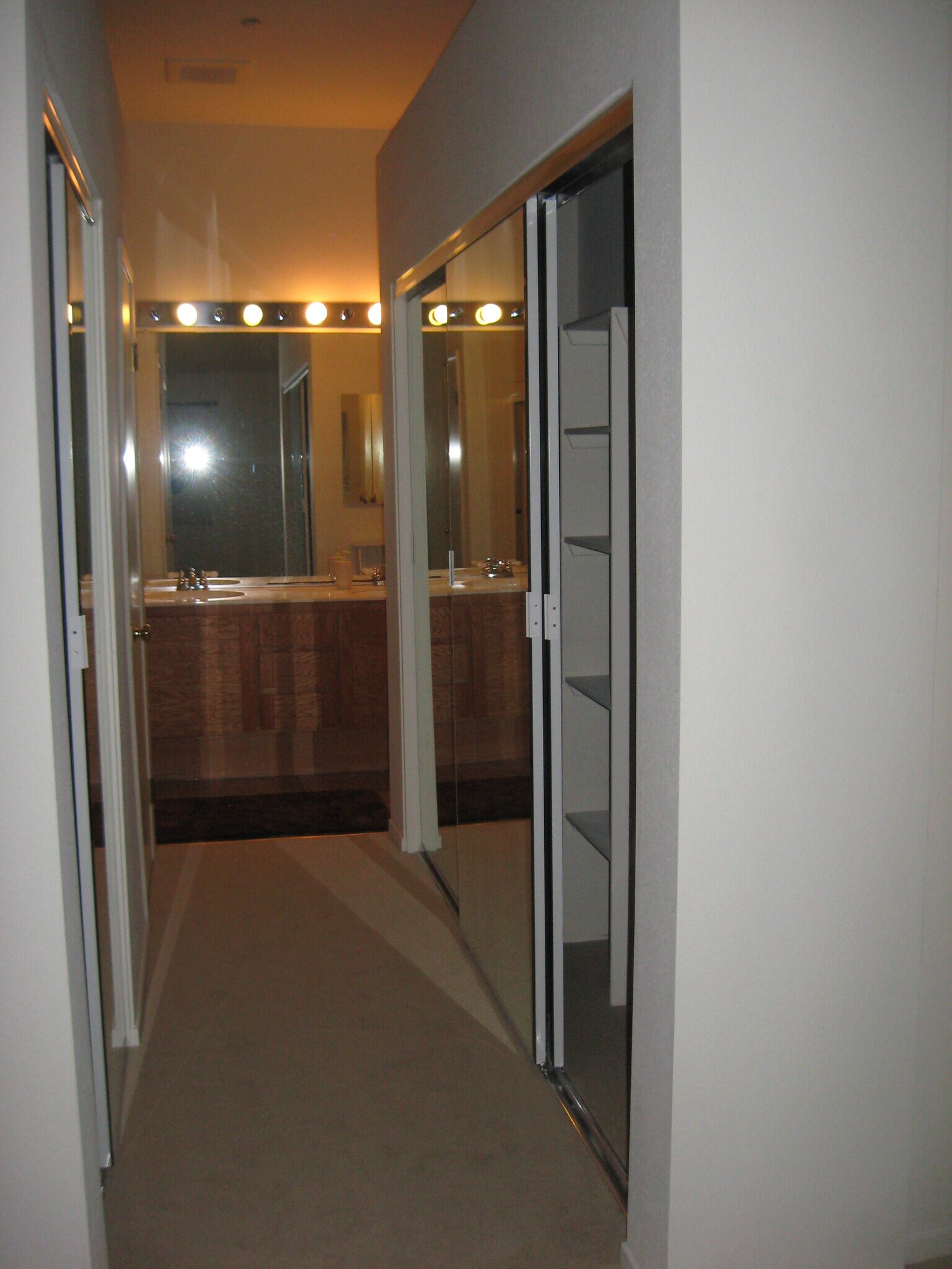 Master Bedroom His and Her closets with full size mirrors on closet doors. - 6999 Rodling Dr
