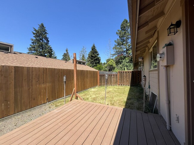 Building Photo - Bright and Airy Home with Stainless Steel Kitchen, Vaulted Ceilings & Washer + Dryer