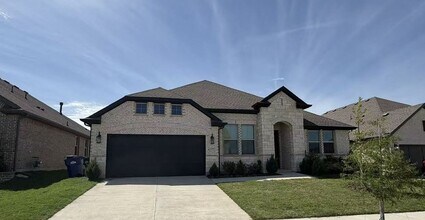 Building Photo - Move-in ready and like-new! Washer, dryer, and refrigerator Included.
