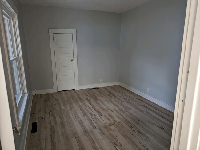 1st floor bedroom new flooring & window. Dual closets - 834 N Elizabeth St