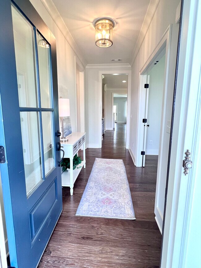 Entryway leading to the main living space. Office to the right; secondary bedrooms/bath to the left. - 47 Bowman Ct