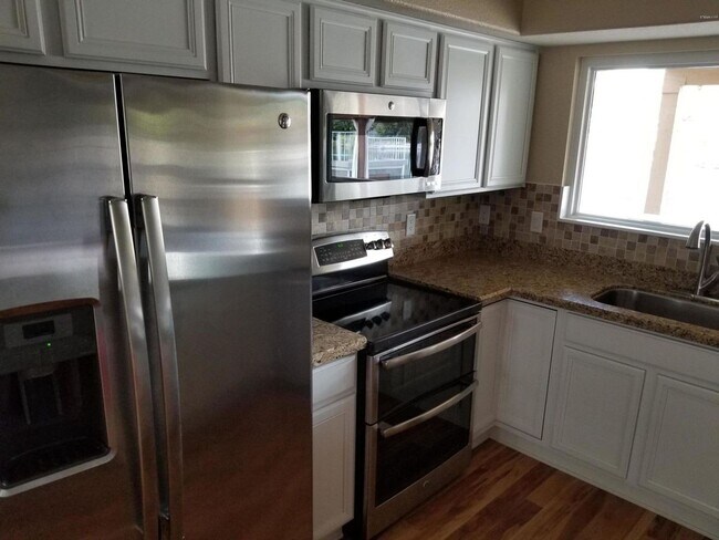 Building Photo - AVAILABLE NOW IN THE SPRINGS ON THE LAKE I...