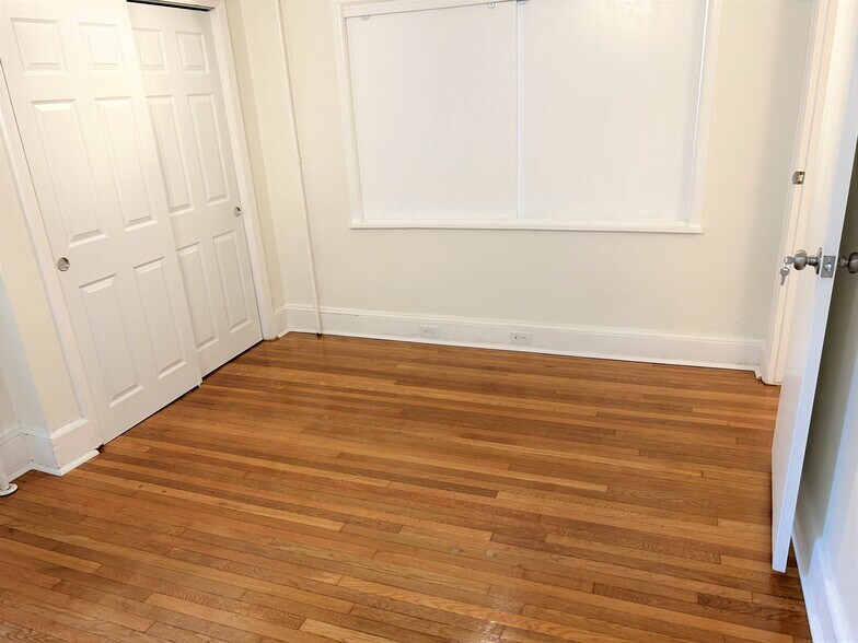 Bedroom with Sliding Panels - 508 Central Ave