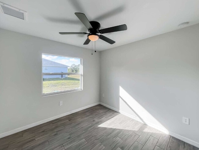 Building Photo - Move-In Special! Half Month FREE – APPLY by November 30th – Modern 3BR/2BA Duplex in Lehigh Acres...