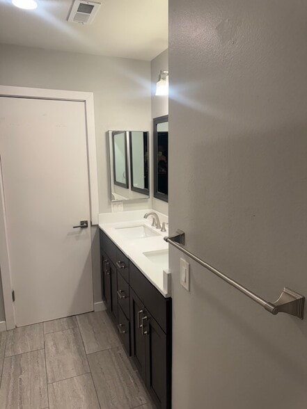 upstairs bathroom with double vanities - 15955 Mauna Ct
