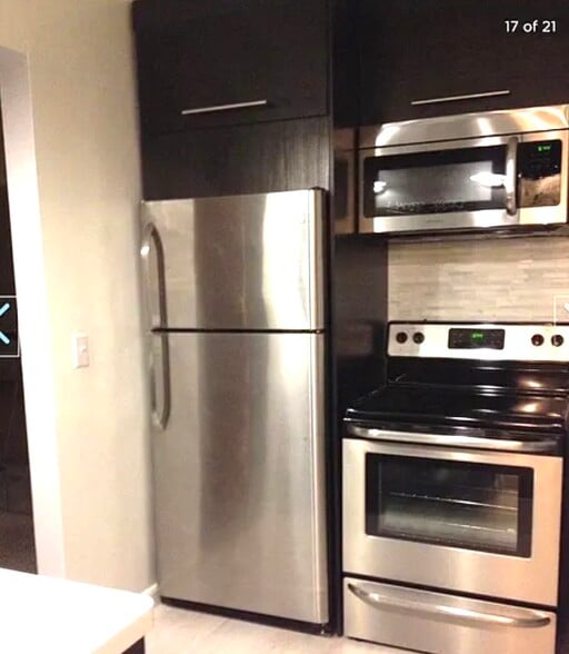 Kitchen w/warm lights on - 77 Atterbury Blvd