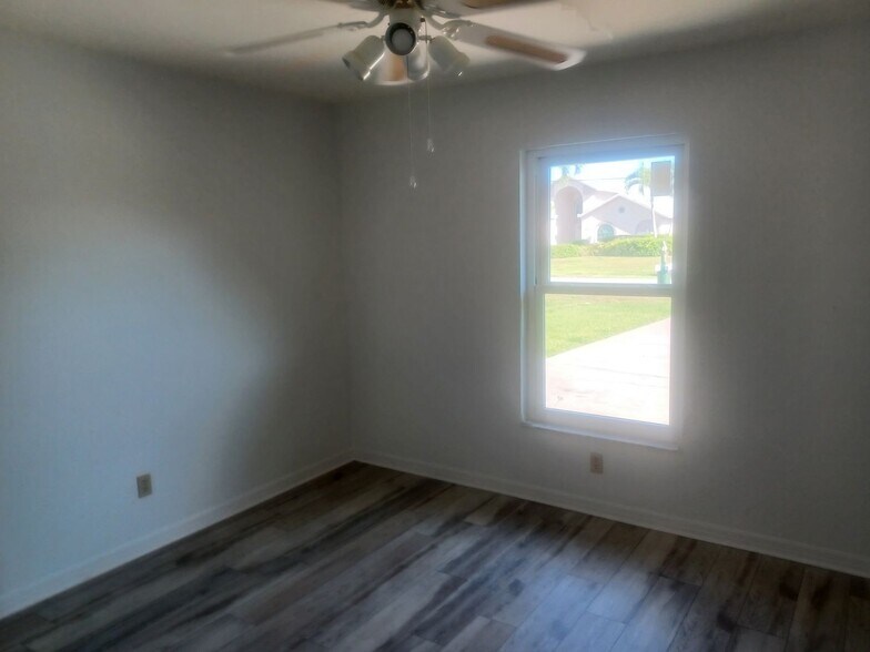 Building Photo - COMING SOON: Spacious Gulf Access 3 BR / 3 BA Home With a Large Screened Lanai for Entertaining &...