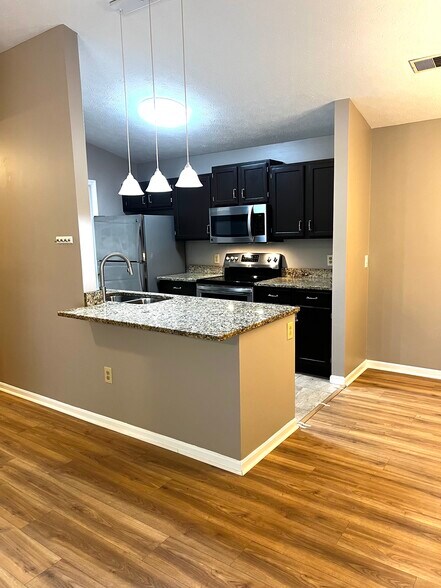 Kitchen with area for counter stools - 7680 Scioto Ct