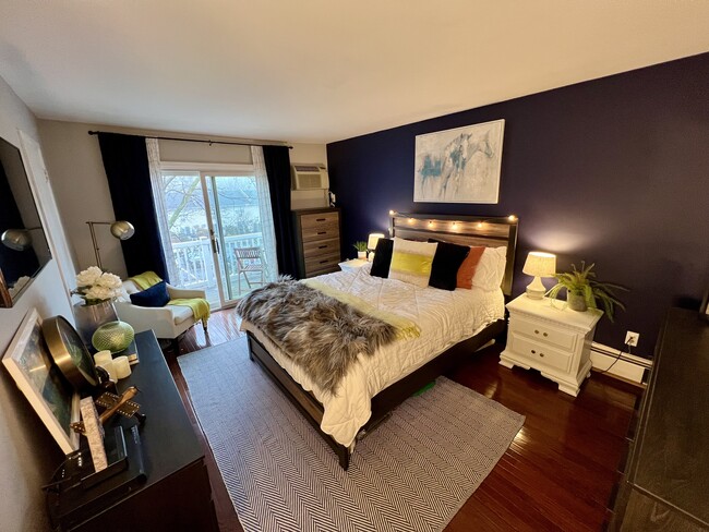 Bedroom w/ access to private balcony - 140 Doxbury Ln