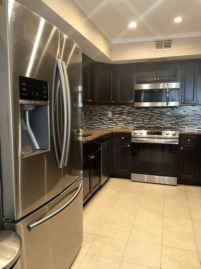 Building Photo - THE TRIAD TOWNHOMES IN CARROLLWOOD