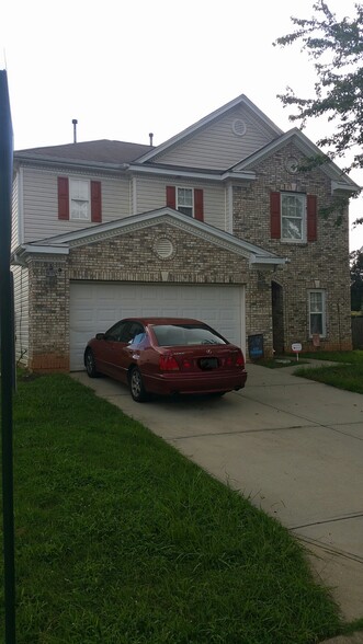 White speckled brick front home, 2 story with 2 car garage - 4345 Stone Mountain Drive