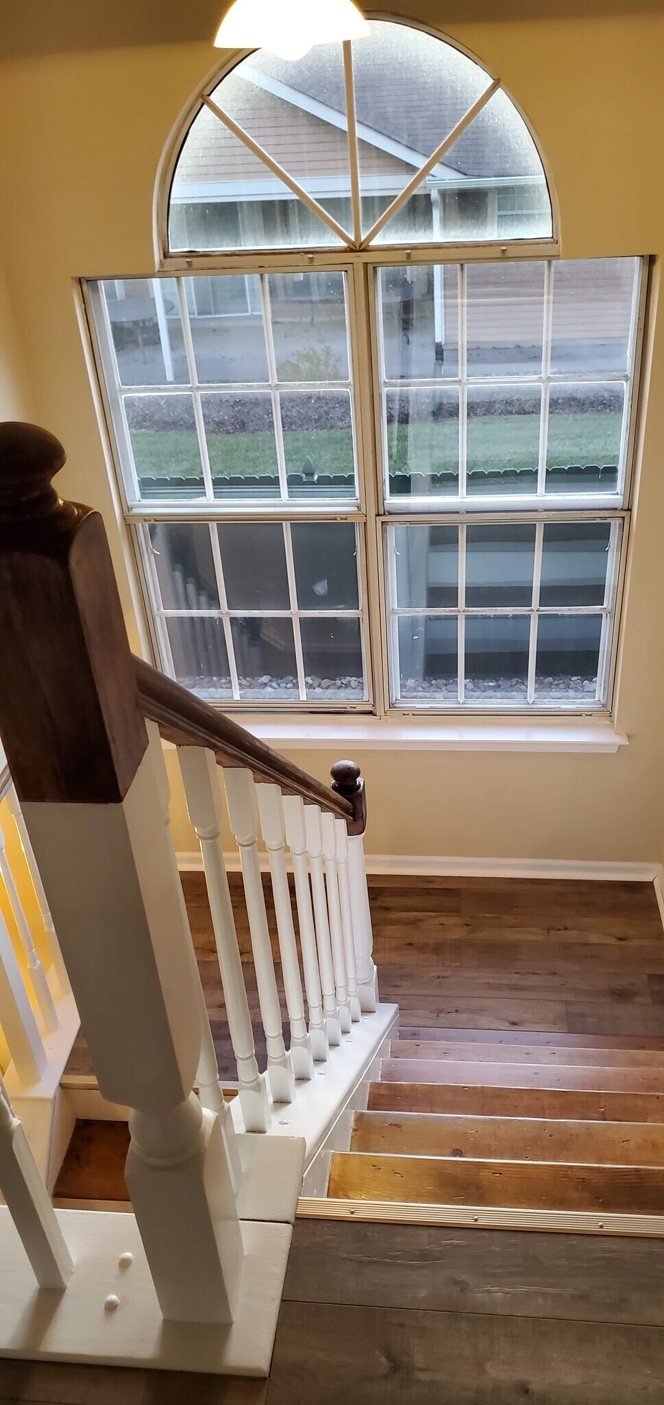 View from stairwell down to Foyer - 610 Larch Ct