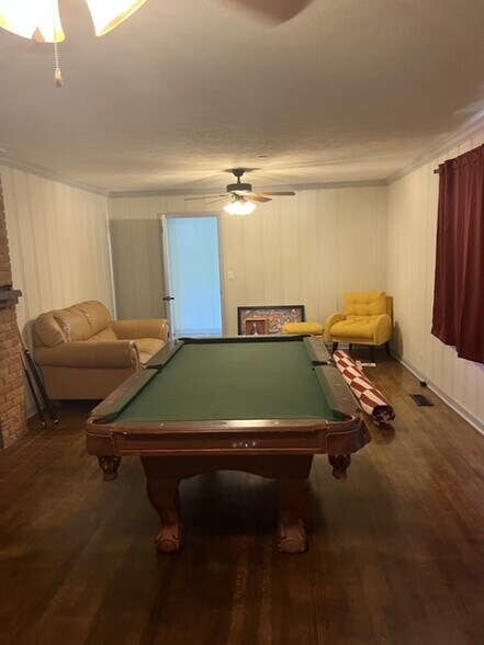 Old Photo when it was a game room- currently rented as a bedroom - 905 Louisville St