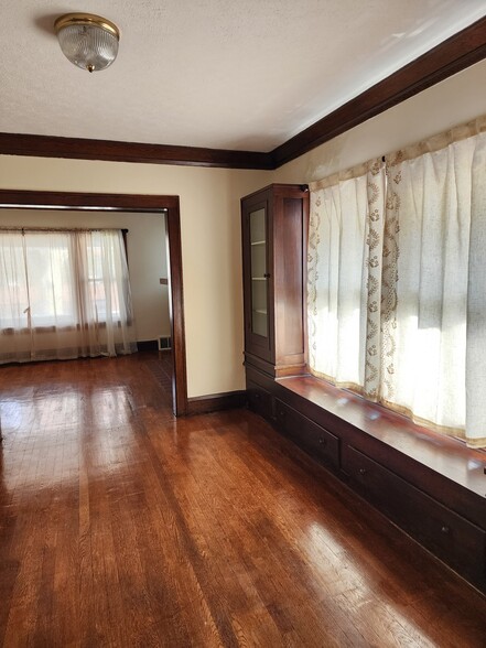 Spacious Dining Room with Hardwood floor and built-in cabinets. Curtains included - 1382 Webb Rd