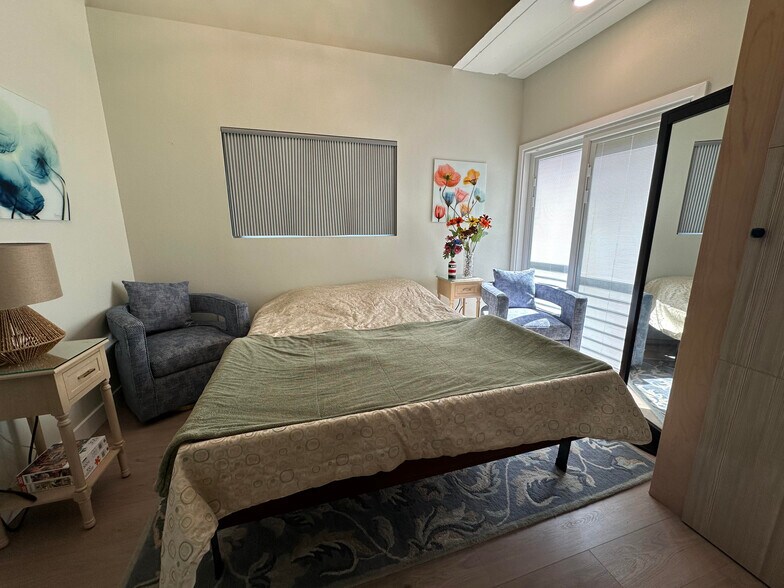 Bedroom 2 with queen-sized Murphy Bed folded down for sleeping - 1490 Ash St