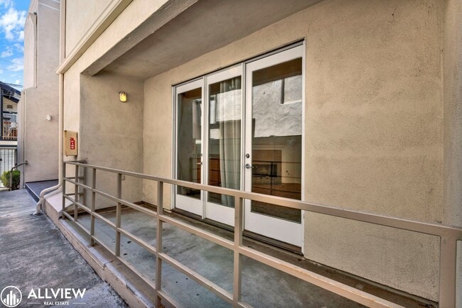 Building Photo - Spacious Coastal Condo with Rooftop Ocean ...