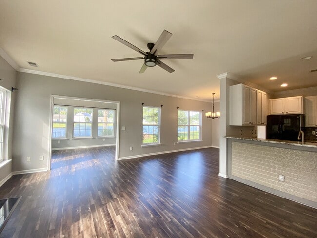 Building Photo - Three Bedroom Home with fenced-in Backyard oasis!