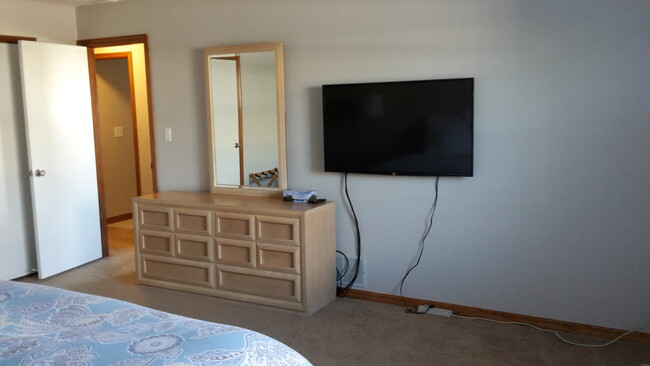 42" smart TV in master bedroom - 47 Sea Island Dr N