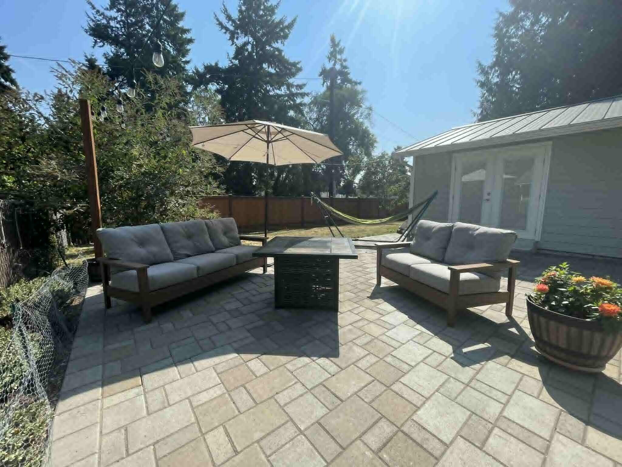 Large outdoor patio, perfect for relaxing on a sunny day and hosts private entrance to primary suite - 245 S 126th St