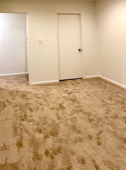Hallway to bathroom and door to stairs - 22506 Quinta Rd