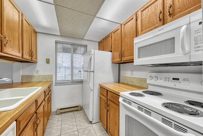 Building Photo - $1,245.95, 1 bed, 1 bath, garden level Condo with Washer/Dryer