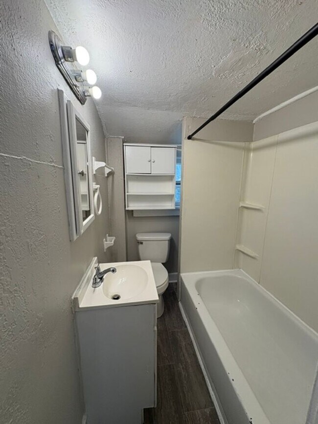 Building Photo - A cozy 2 bedroom home with versatile living space and plenty of storage including a partially fin...