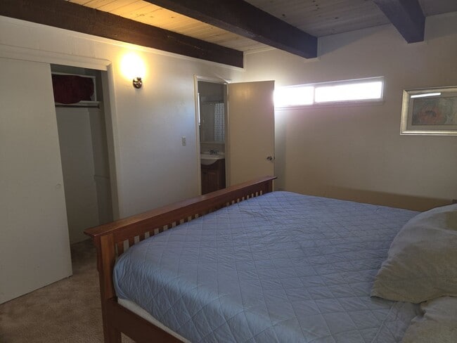 Building Photo - Unique open design,wood beams in all rooms-Very cheery and cozy. Newly remodeled, and newly furni...