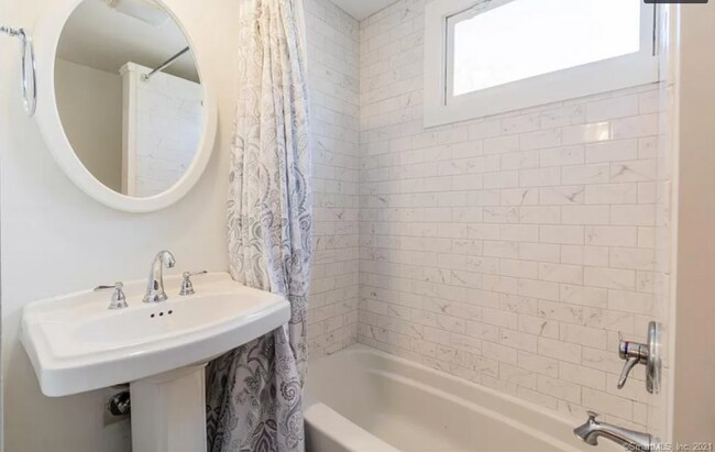 Newly updated downstairs bathroom with tub/shower combo - 46 Crescent Ave