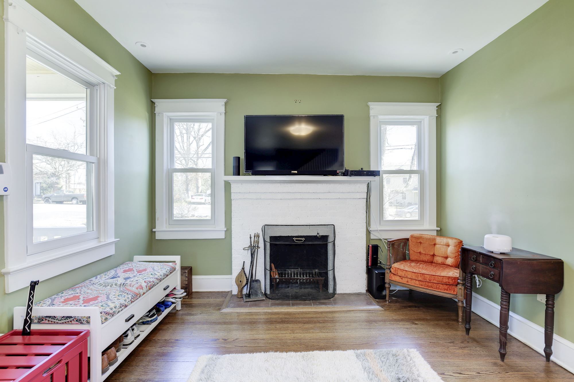 Living room boasts wood-burning fireplace! - 4604 4th St S