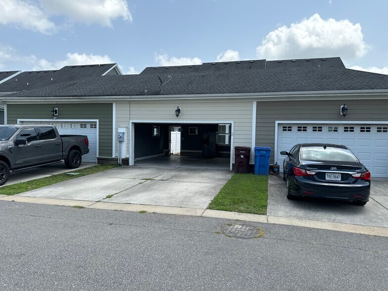 Two car outside parking. - 611 Veery St