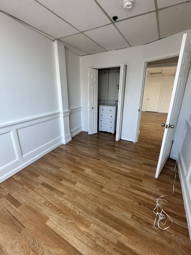 Bed room 3 with large closet and new double paned windows. - 5 E Broad St