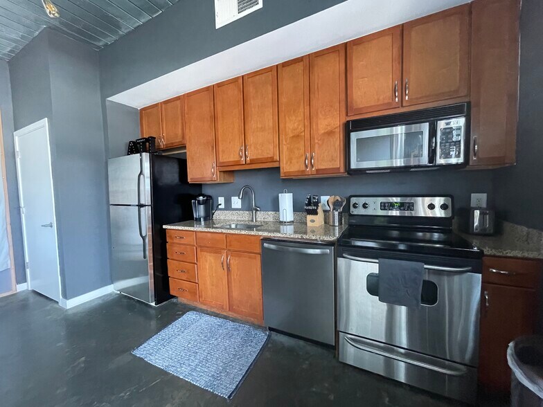 washer and dryer located in the closet left of the kitchen - 620 Glen Iris Dr NE