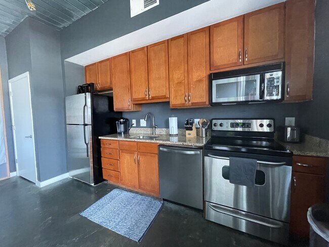 washer and dryer located in the closet left of the kitchen - 620 Glen Iris Dr NE