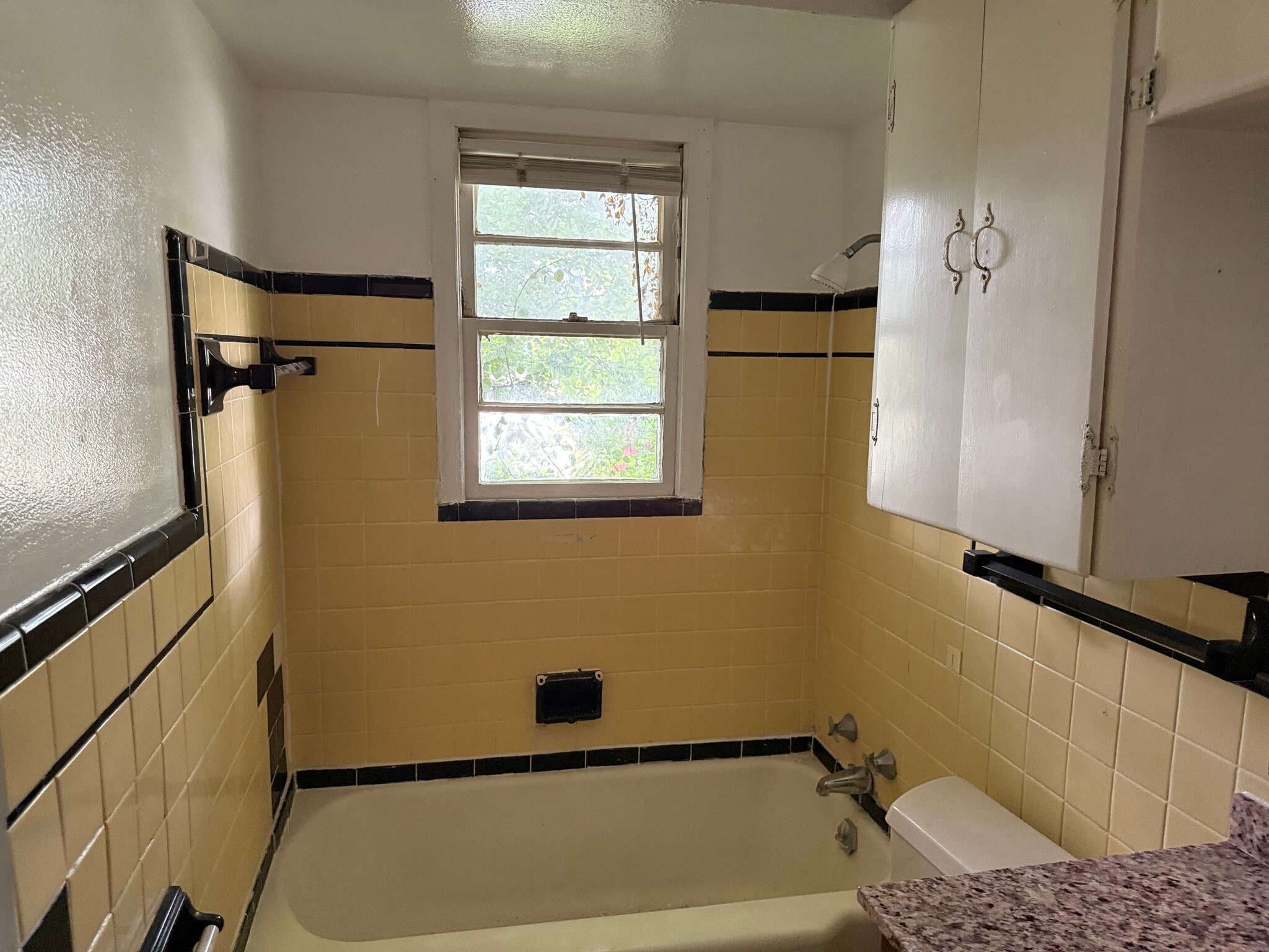 Front bathroom. Window faces Tidal Wave car wash. - 2410 Forest Home Rd