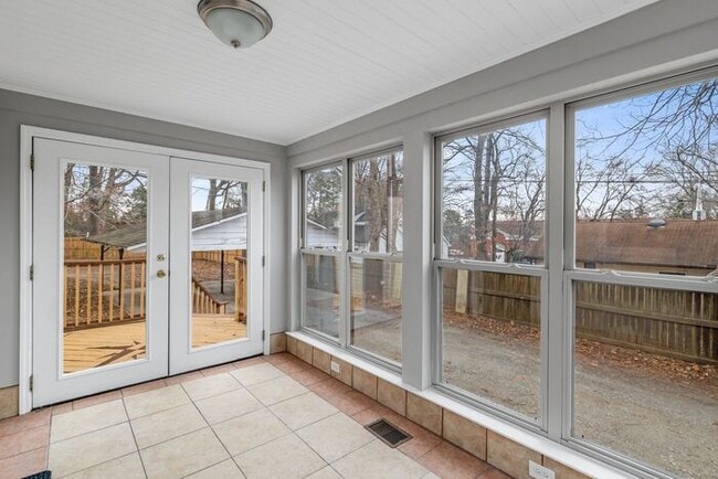 Building Photo - Brick home, Two Story, Hardwoods, DR, 2 Sun Rooms, FP, Carport!.