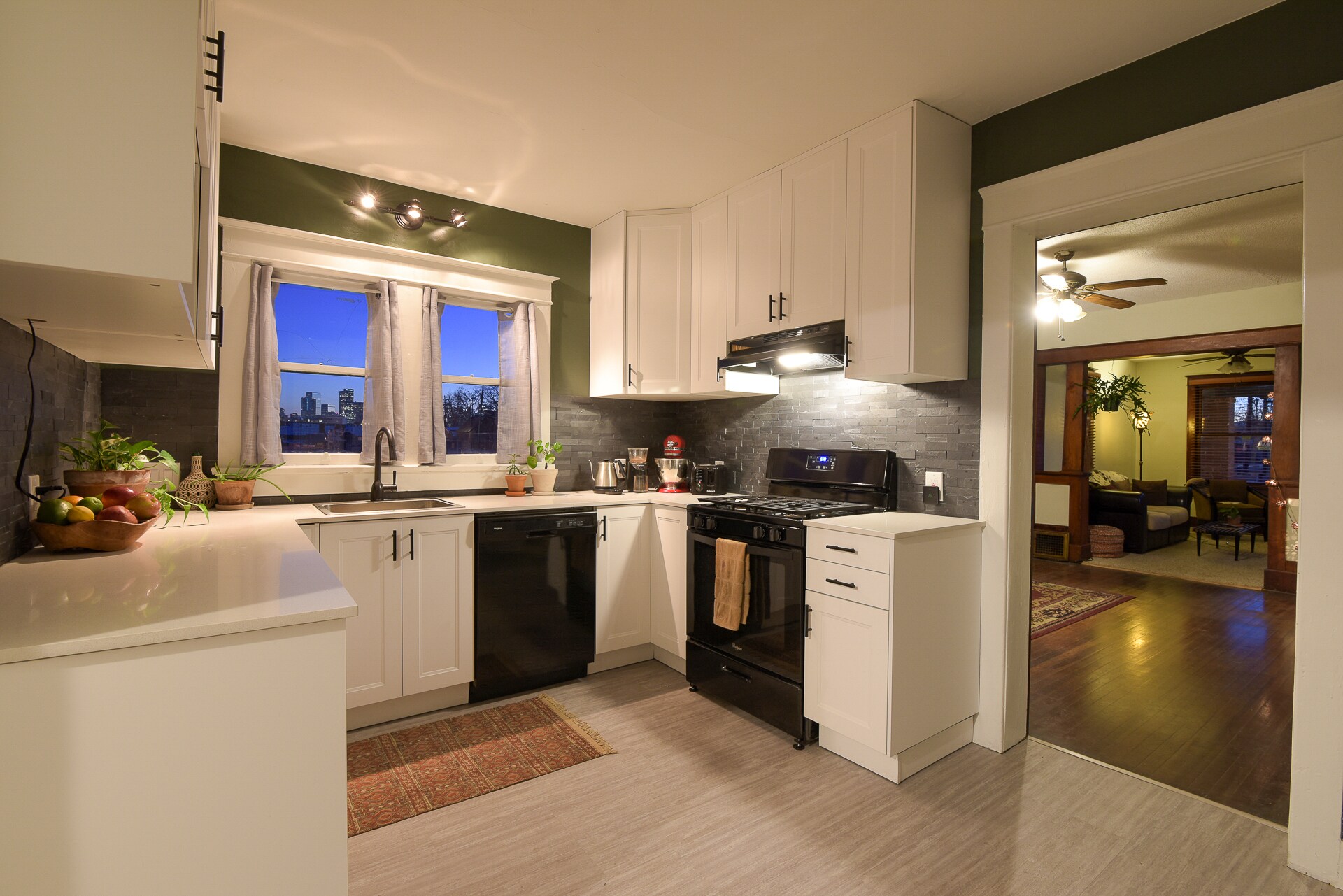 New kitchen, quartz counters, gas range, dishwasher, disposal, storage for days, downtown views. - 4404 Sherman St
