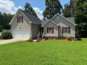 Building Photo - Location! 4 bedroom with garage convenient...
