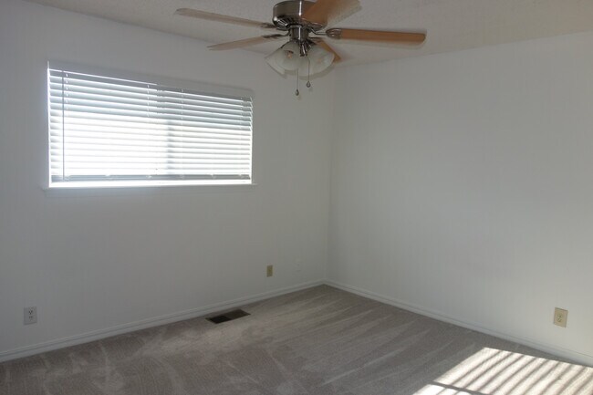 Primary Bedroom with ceiling fan - 3421 E 35th St