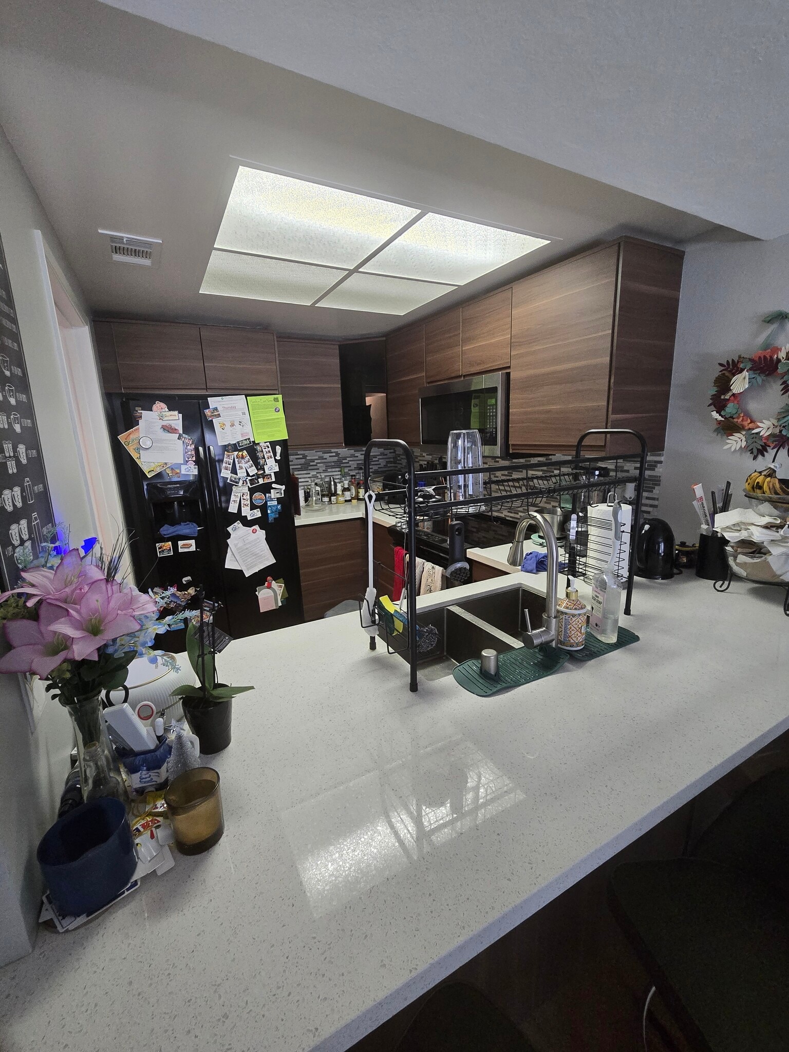 Kitchen area and bar - 613 Millich Dr