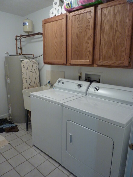 First floor laundry room with washer and dryer provided. - 1413 Loop Road