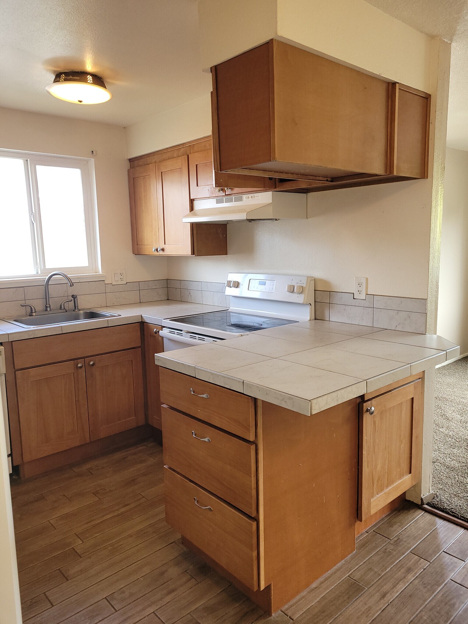 unit d kitchen with large drawers on the end of the counter - 1045 S Jasper St