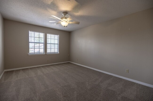 Building Photo - ONE FREE MONTH ON 13 MONTH LEASE! Welcome to this charming 3-bedroom, 2-bath condo located in the...