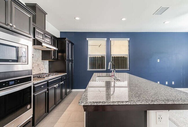 Building Photo - Charming Riverstone Home with Spacious Kitchen Island & Private Backyard & Solar