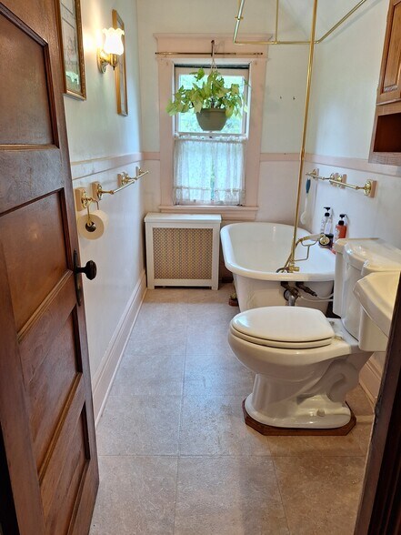 Bathroom with clawfoot soaking tub and shower - 384 Hall Ave