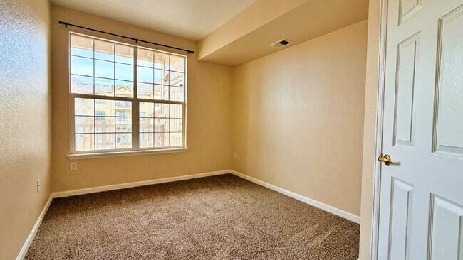 Building Photo - NEW CARPET NEW PAINT!! Clean and Bright 2BR 2BTH Condo Close To DIA. Gated Community in First Cre...